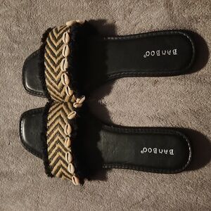 Slide sandal with shell accents worn maybe for 1hr